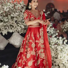 A full-length view of Tessa's minimal wedding look. She looks so happy and carefree, ready to dance and celebrate her big day.