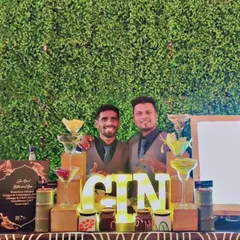 We created this dedicated Gin Bar against a lush green wall, complete with marquee lighting and a variety of infused gins. It’s a perfect example of a specialized station that caters to specific tastes.