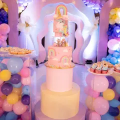 Even the cake has to match the theme! This incredible three-tier unicorn cake was the centerpiece of the dessert table, surrounded by pastel balloons and treats.
