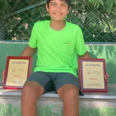 This is what early dedication looks like. Arjun Dua proudly displays his winner's plaques for both the Boys U-12 Singles and Doubles titles at the Super Series tournament in Rajkot, showing the strong foundation we build in our junior players.