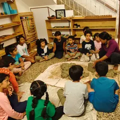 Back in the classroom, we gather in a circle to learn how to process the harvested clay, preparing it for sculpting by removing impurities.