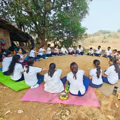 Our students gathered in a circle during a winter yoga trek. Taking our practice outdoors connects us with nature and deepens our sense of community.