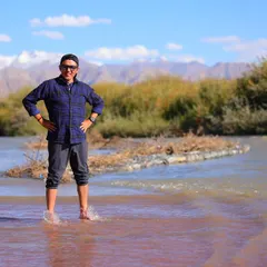Taking a moment to cool down and recover in a shallow river. This kind of natural cold water therapy is perfect for soothing tired muscles after a long run.