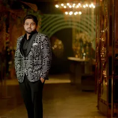 Another shot of our client in the patterned tuxedo, showcasing his confident stance and the impeccable fit of the suit.