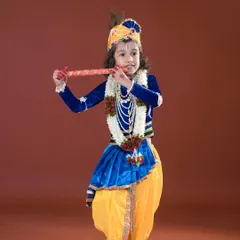 Celebrating Janmashtami with a little Krishna. We provide beautiful costumes and props, like this flute and garland, for a perfect festive photoshoot.