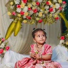 A precious moment from a client's naming ceremony. I designed this traditional pink pattu langa for baby Diya, featuring a classic brocade fabric that is both beautiful for photos and comfortable for her to wear.