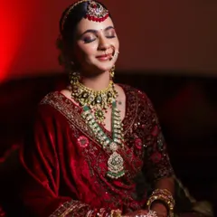 A quiet moment of reflection for the bride before she walks down the aisle. I used dramatic lighting to highlight the richness of her velvet lehenga and the artistry of her bridal look, creating a timeless and emotional portrait.