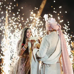 The magic of cold pyro. I love timing special effects like these sparklers to highlight the most emotional moments, like the exchange of garlands, making the memory even more special for the couple and their guests.