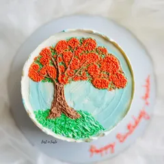 This cake is a tribute to the beautiful Gulmohar tree. The design is hand-piped with colored buttercream to create a miniature painting you can eat.