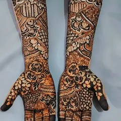 Another view of this floral bridal henna, showcasing the symmetry and flow of the design across both arms. The dark stain from my organic henna paste really makes the details pop.