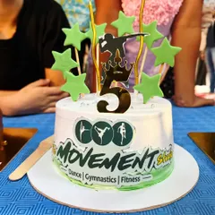 Every milestone is special, and we celebrate them with cake. This custom cake for our studio's 5th anniversary shows our core pillars: Dance, Gymnastics, and Fitness.