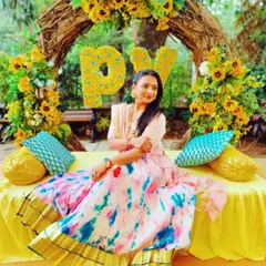 Enjoying the beautiful, sunny decor at a Haldi ceremony. I love incorporating personalized details, like the couple's initials made of flowers, to make the event uniquely theirs.