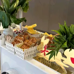 A charming food cart setup for a Christmas-themed event. We served festive treats from this cart, which was decorated with reindeer cutouts and other holiday details.