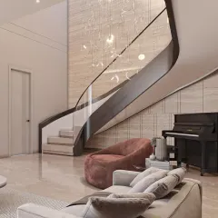 A staircase can be more than just a connection between floors; it can be the sculptural heart of a home. Here, we used a flowing design against a textured marble wall to create a focal point that is both art and architecture.