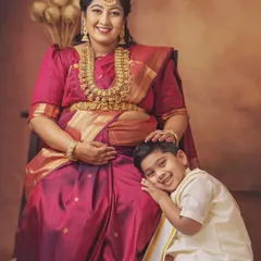 The bond between a mother and her first child is so special, especially when a new baby is on the way. This little boy's happy smile as he rests his head on his mother's lap is just precious.