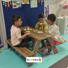 Tea party time! These friends are enjoying a pretend meal at our kid-sized picnic table.