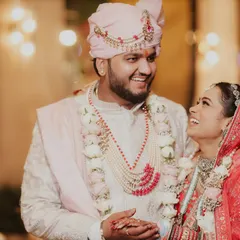 For me, the real magic is in the unplanned moments. This candid shot of Riya and Nikhil sharing a laugh at Royal Arches Farms is what I live to capture, the pure, unscripted joy of two people in love.