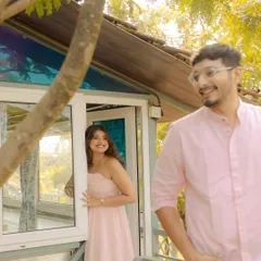 A sweet, candid moment of peek-a-boo at a cozy villa. This playful interaction shows the couple's comfortable and easy chemistry.