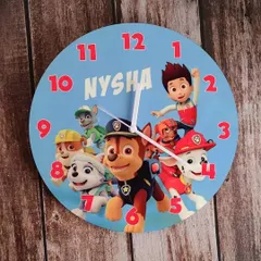 A Paw Patrol themed wall clock, customized with the name 'Nysha'. I can create clocks with any of your child's favorite cartoon characters.