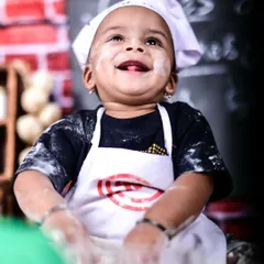 Meet the world's cutest little chef. Themed sessions like this are my specialty, and I provide all the props and costumes. We had so much fun with this messy, flour-dusted shoot, capturing this little one's pure, uninhibited joy.