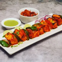 A full platter of my freshly grilled Paneer Tikka, garnished and ready to be served. This is one of the most popular vegetarian appetizers for weddings, birthdays, and corporate events.
