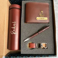 This is the brown version of my four-piece gift set for men. It includes a personalized wallet with a crown charm, a matching temperature bottle, a pen, and a keychain, all presented in a stylish gift box.