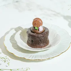 Craving something sweet? Our molten chocolate cake, topped with a delicate macaron, is available exclusively on Zomato & Swiggy for delivery to your doorstep.