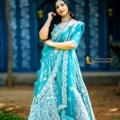 A stunning sky blue lehenga with heavy white and silver embroidery. The net fabric is lightweight and comfortable, while the intricate work gives it a grand appearance.