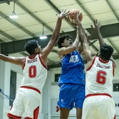 Battling for the rebound in a tough match. Physicality and grit are non-negotiable in these high-stakes games.