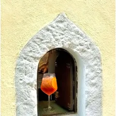 When life gives you an Aperol Spritz, you take it. This beautiful shot captures the golden hour glow in a glass.