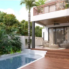 This poolside deck is designed as a private oasis for mindfulness and relaxation. We integrated a tranquil water body with a comfortable seating area and lush tropical foliage, creating a seamless connection to nature. It’s a perfect example of how we design outdoor spaces that function as serene extensions of the home.