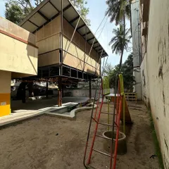 The RBANMS classroom extension next to the playground. The lightweight steel structure and simple materials were chosen to be economical and quick to erect, minimizing disruption to the school.