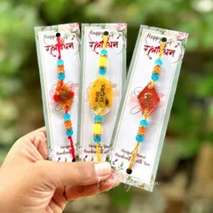 A collection of my handcrafted resin rakhis, each one unique and made with love. These designs feature beautiful beads and personalized messages like "Veera" for your brother.
