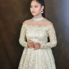 A simple yet stunning look. This white gown is paired with a delicate American Diamond choker and minimalist earrings, showing that modern elegance is all in the details.