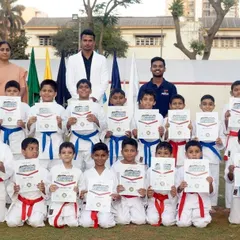Our students proudly display their certificates after a karate demonstration for the OLPS Sports Day. We believe the ultimate aim of our art is not victory or defeat, but the development of strong, confident, and well-rounded individuals.