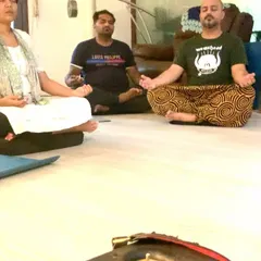 Participants meditating during the Chakra Balancing workshop. The focus here is on deep inner work, learning techniques to self regulate and manage your own energy for long term wellness.
