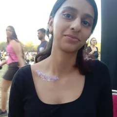 A simple and elegant swipe of purple and silver glitter on the collarbone. It's like wearing a piece of jewelry.
