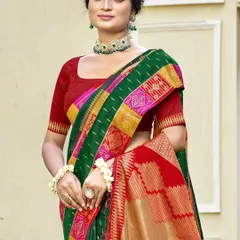 This bottle green Dupion silk saree is a classic beauty. The rich color and traditional border make it a perfect choice for any formal or festive occasion.