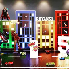 Your child's favorite heroes can assemble for their big day. This is a design concept for an Avengers party, showing how I create a dynamic city scene with 3D character props and custom light-up signs.