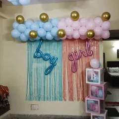 A simple and clear gender reveal backdrop. I use two different colored foil curtains, pink and blue, with matching "Boy" and "Girl" foil letters and a balloon garland on top. The "BABY" boxes can be filled with balloons of the chosen gender.