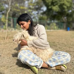 A gentle cuddle with a fluffy companion. This quiet moment reflects the soft, nurturing side of our work. It's about providing comfort and affection in a way that the animal understands and accepts.