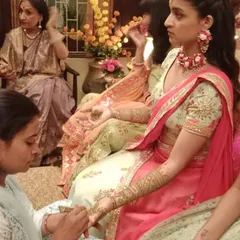 Here I am applying mehendi for an artist on a film shoot, a fun experience creating designs for a wedding scene.