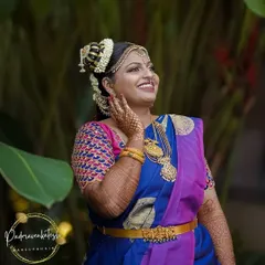 I specialize in authentic Iyengar bridal makeup. This look features the traditional Andal-inspired 'kondai' hairstyle, intricate eye makeup, and radiant skin, creating a divine and timeless appearance for the wedding ceremony.