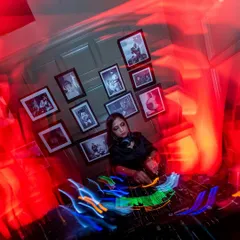 An artistic shot from a techno set that captures the motion and energy of the night. I love weaving together dark minimal grooves and melodic techno, and this image, with its light trails, perfectly visualizes the dynamic soundscape I build.