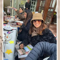 A happy moment from a transformative Sunday Vision Board party. It's an inspiring afternoon where everyone unleashes their creativity, enjoys uplifting conversations, and leaves with a tangible reminder of their goals.