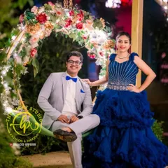 A fun and formal pre-wedding look. I styled the groom in a light grey suit with a blue bow tie to perfectly complement his partner's royal blue gown.