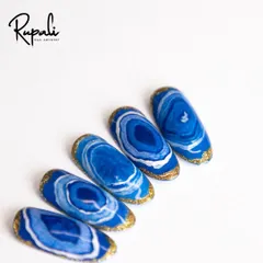 I call this my 'sea effect' design. The deep blues and whites, edged with gold glitter, remind me of ocean waves and agate stones.