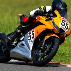 Here, a rider is deep into a corner, showcasing a significant lean angle. I guide my students to progressively and safely explore the limits of their bike's grip and their own skill on the track.