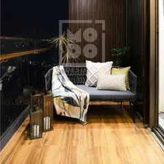 This cozy balcony is the perfect spot to unwind. We used comfortable seating, a stylish throw, and lantern-style candle holders to create a serene oasis for morning coffees or evening relaxation.