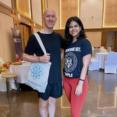 A photo with a participant from a past workshop. It's always a joy to connect with the community and share the practice.